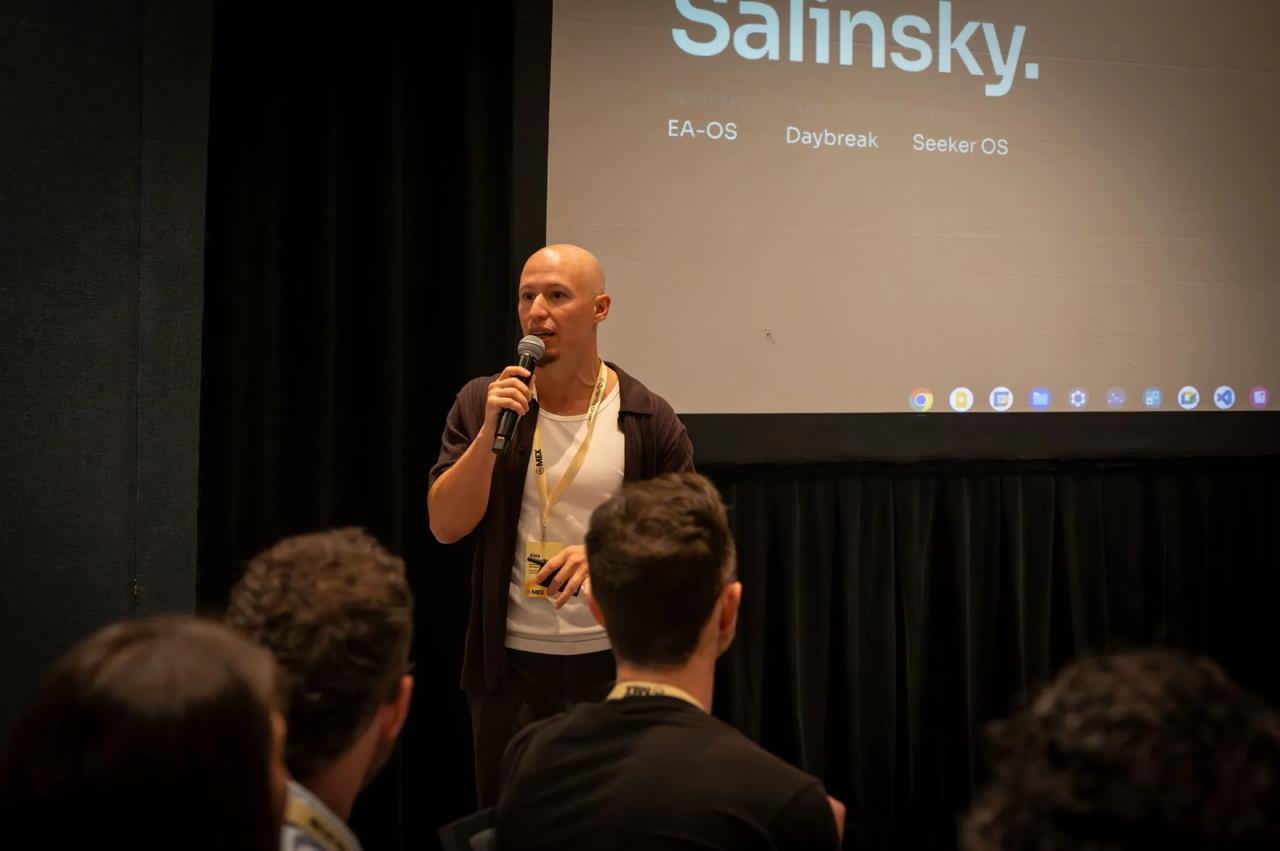 Alex Salinsky presenting on stage
